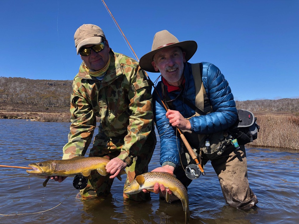 Nick and Nick with a brown trout and a brown trout, on Jeff Wagner bamboo rods