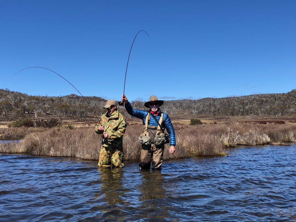Nick and Nick with a brown trout and a brown trout, on Jeff Wagner bamboo rods